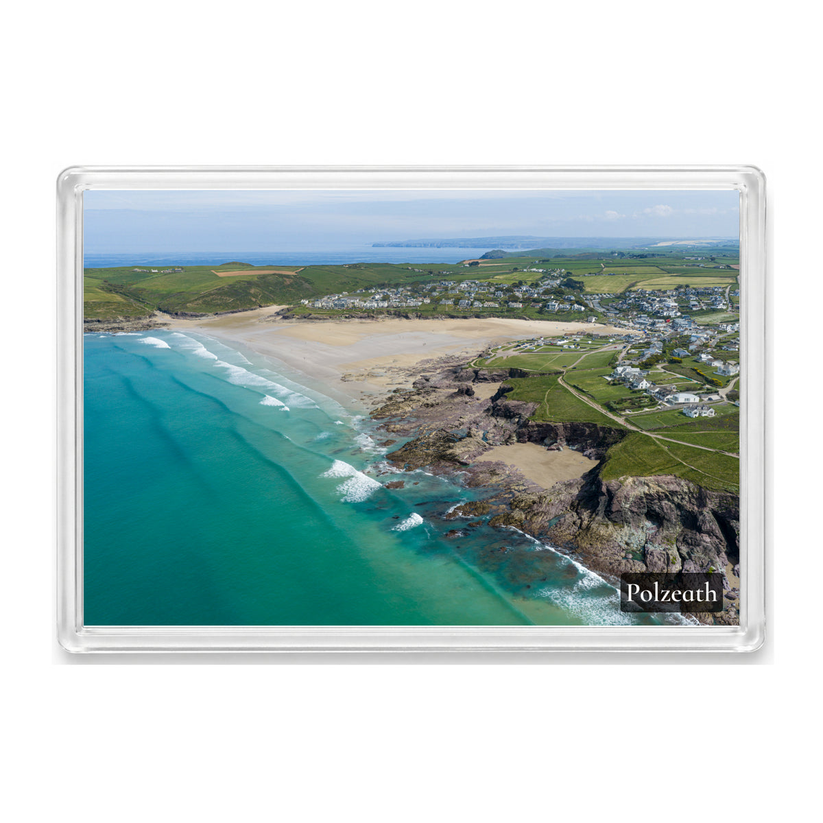 Polzeath fridge magnet showing exposed low-tide rocks and reef surrounded by clear turquoise water and pale sand