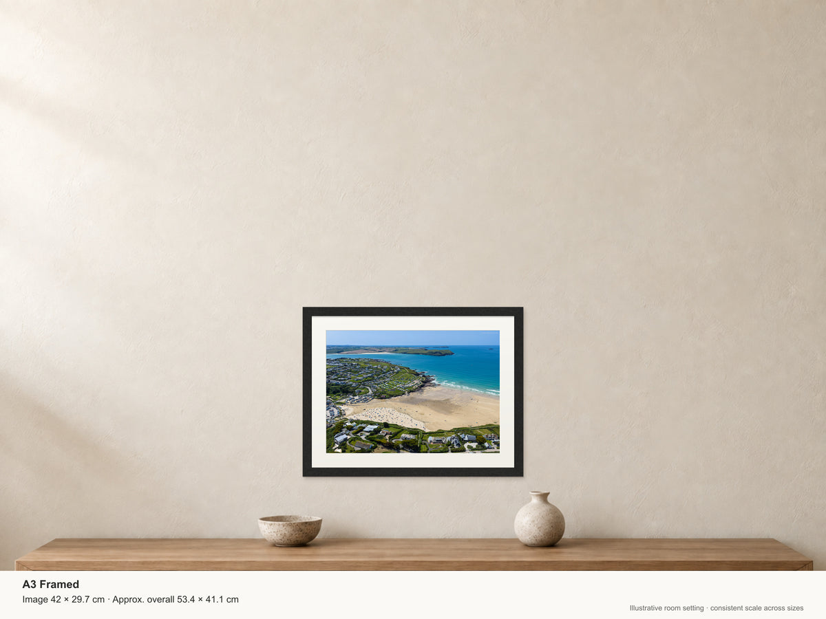 Polzeath — Summer Beach and Stepper Point — A3 framed, 22mm black stained frame and 35mm mount. Illustrative room scale and dimensions.
