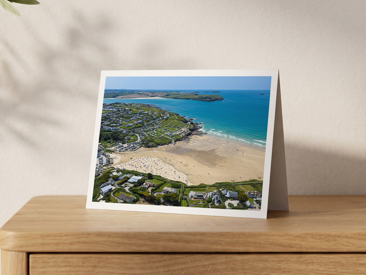 Premium A5 greeting card showing Polzeath beach at low tide on a summer afternoon, with Stepper Point across the Camel Estuary