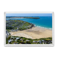 Polzeath fridge magnet showing a busy summer beach at low tide, surf on the sand and Stepper Point across the Camel Estuary