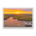 Porthcothan fridge magnet showing sunrise rays breaking from the horizon over Porthcothan Bay in warm autumn colour