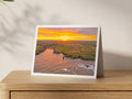 Premium A5 greeting card showing sun rays over Porthcothan Bay at an autumn sunrise