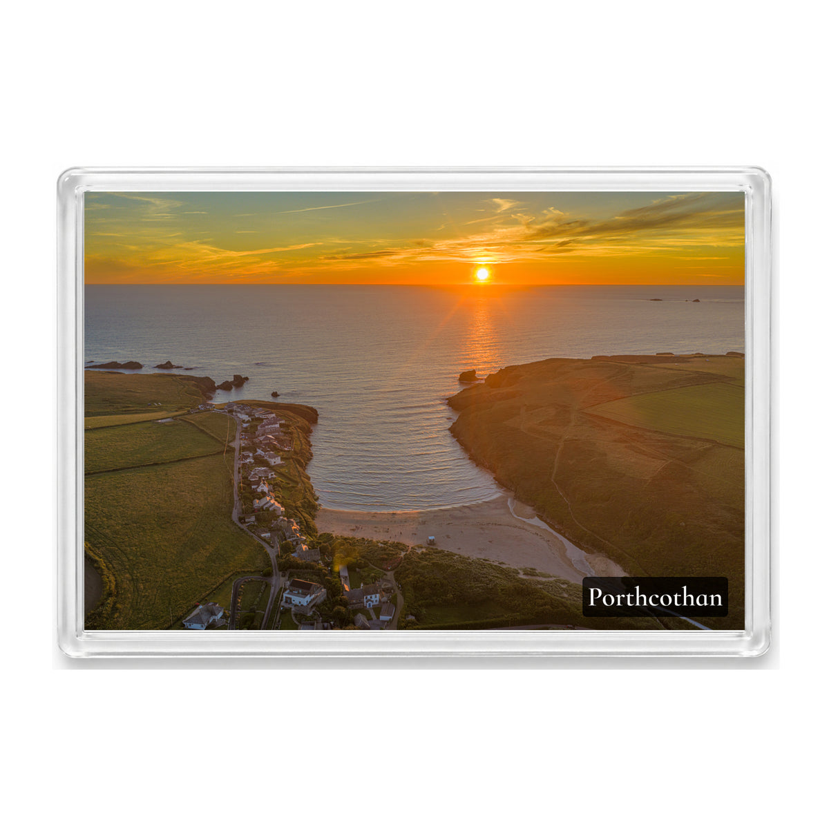 Porthcothan fridge magnet showing the bay at high tide beneath a strong yellow and orange sunset over a calm sea