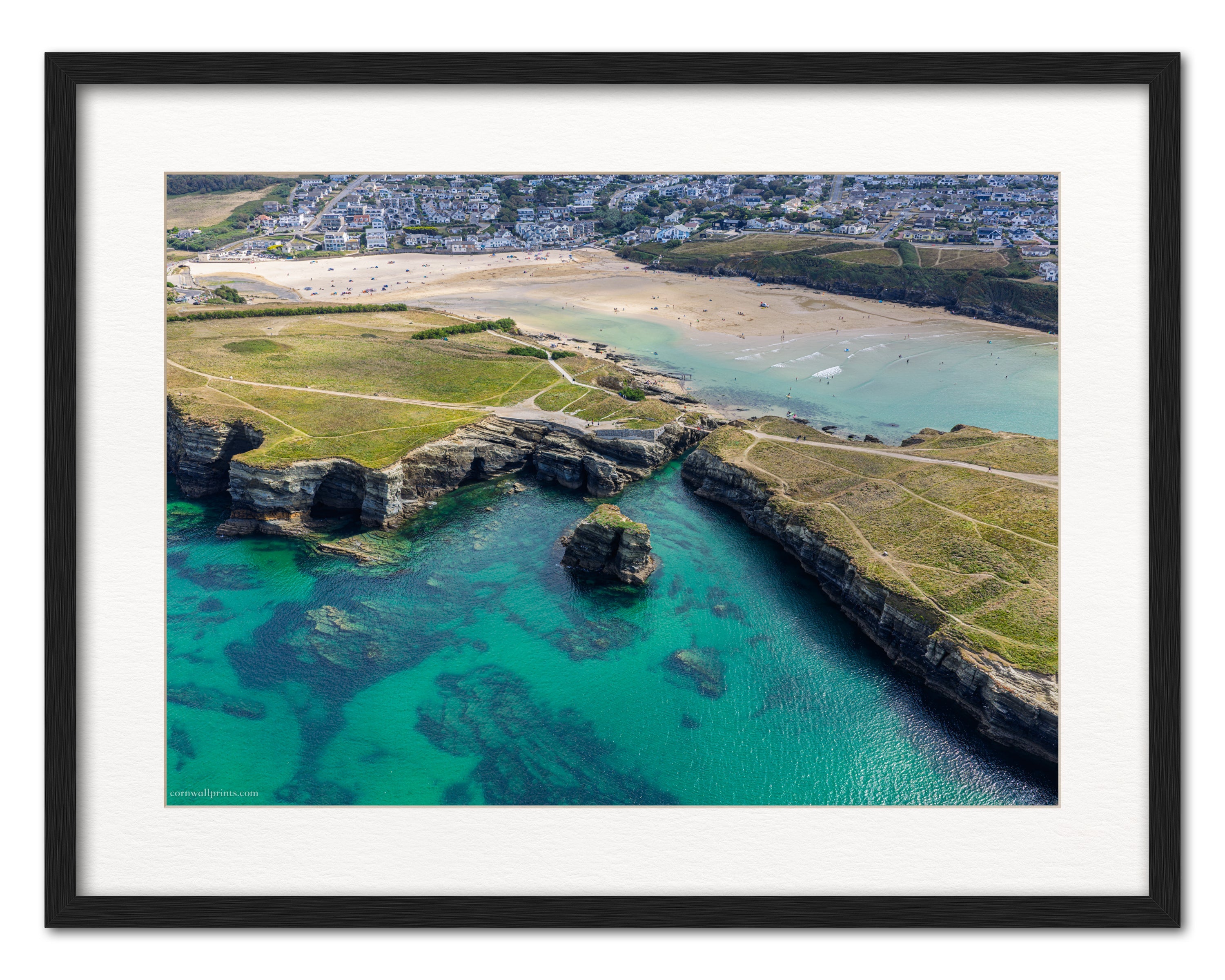 Porth Island footbridge and turquoise water aerial photograph displayed in a black frame with white mount