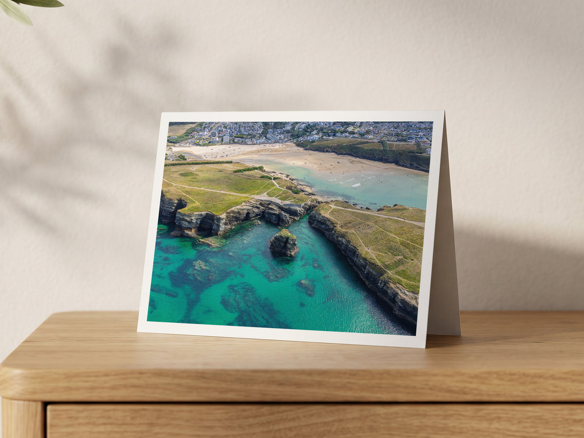 Premium A5 greeting card showing Porth Island cliffs, a rock stack and turquoise water in Newquay