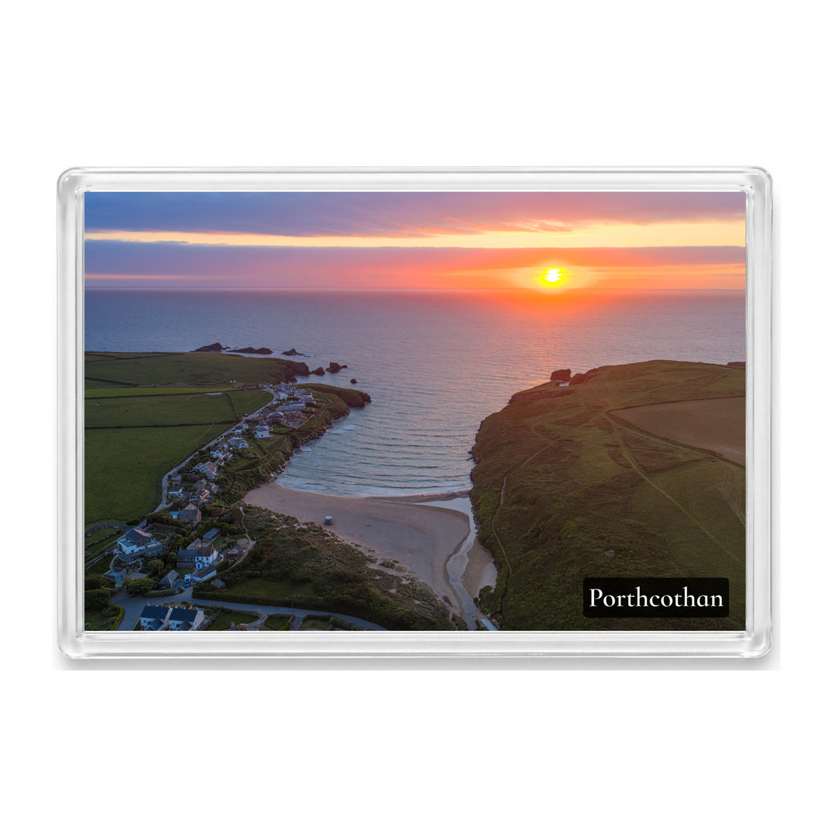 Porthcothan Bay fridge magnet showing a low orange sun over the bay at high tide with a calm sea