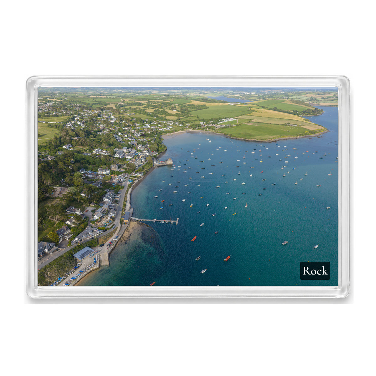 Rock fridge magnet showing the Camel Estuary at high tide with turquoise shallows, dark blue water and boats dotted across it