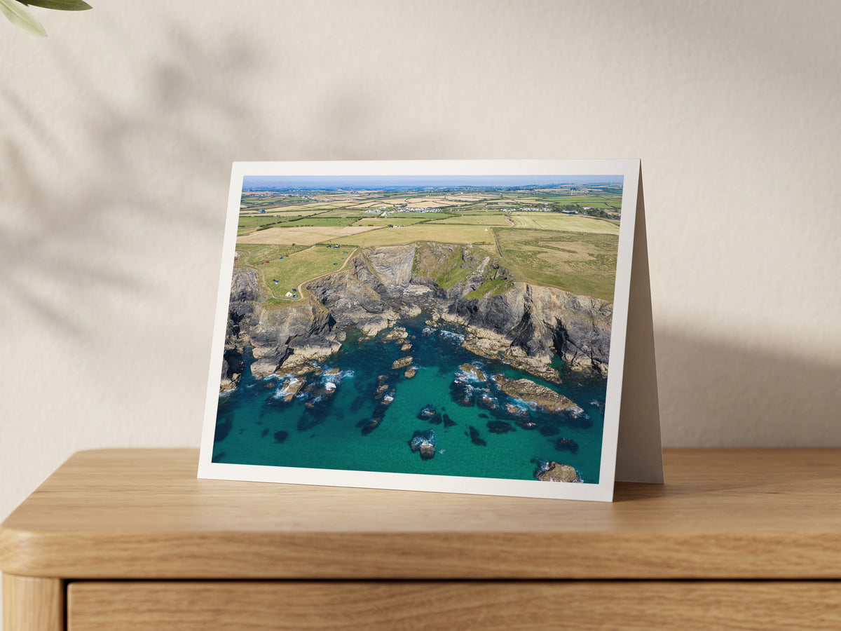 Premium A5 greeting card showing clear turquoise water around the rocks of Rowan Cove near Porthcothan