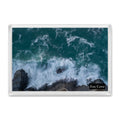 Fox Cove fridge magnet showing slow-shutter surf streaking around a lone rock and over dark layered rocks in deep teal water