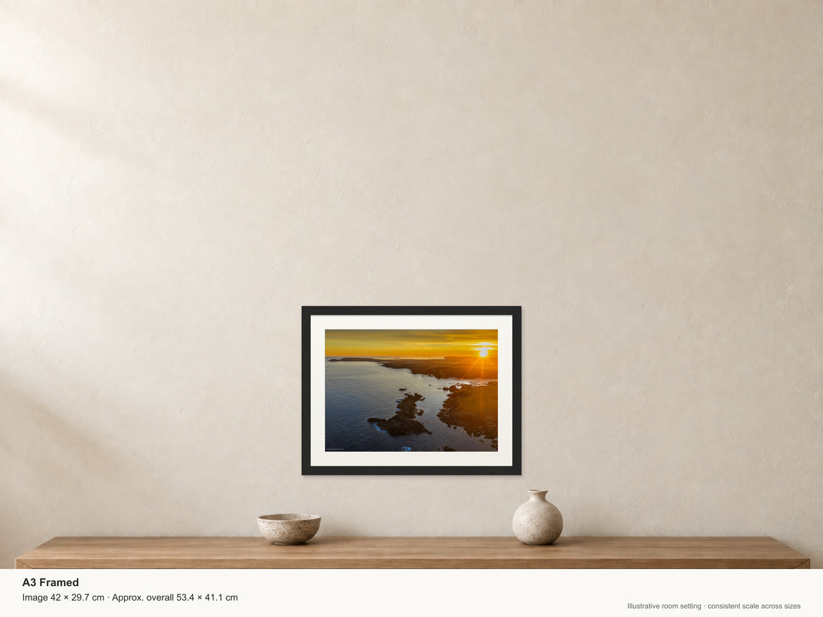 Seven Bays summer solstice sunrise — A3 22mm black stained frame with a 35mm mount. Illustrative room view with dimensions.