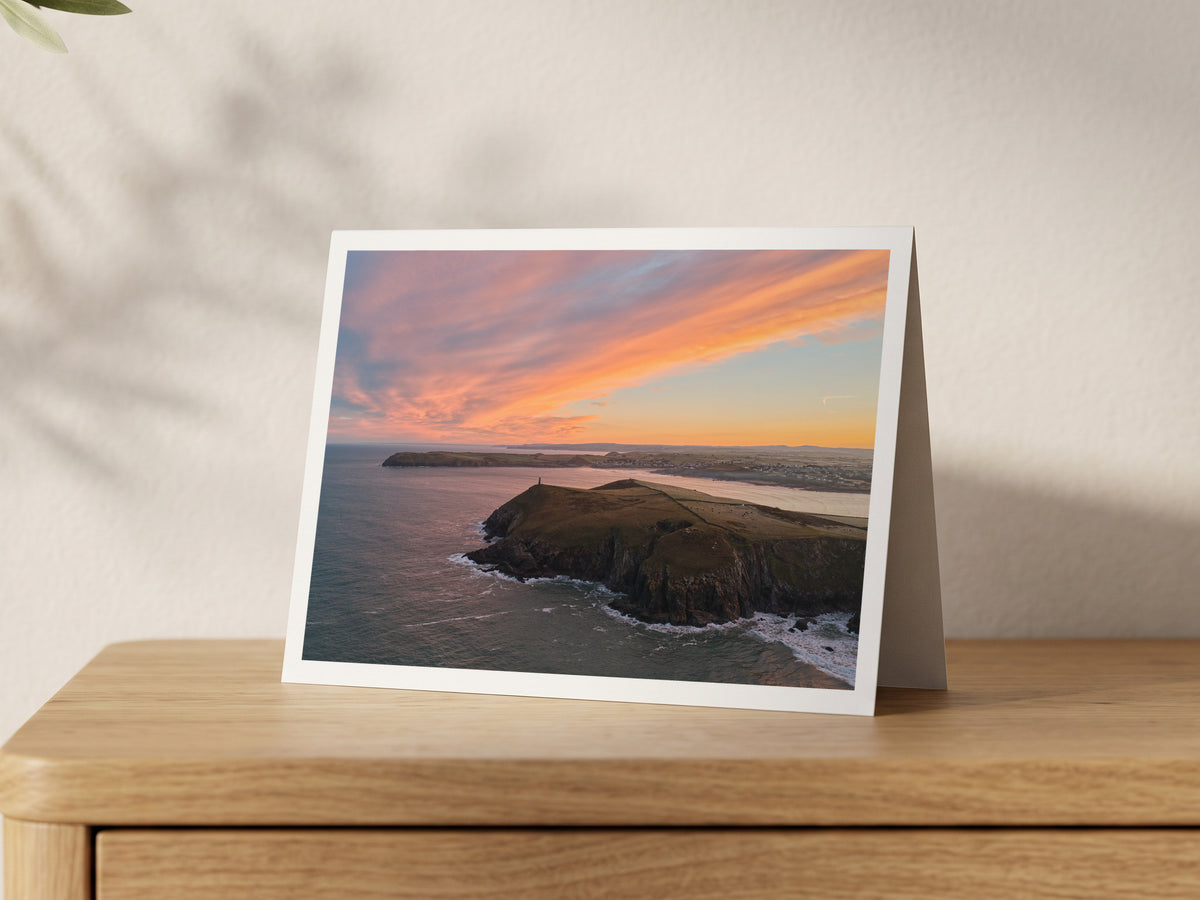 Premium A5 greeting card showing the Stepper Point Daymark beneath a red and gold winter sunrise
