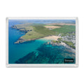 Trevone Bay fridge magnet showing colourful summer water over dark reef with the village, blowhole and Camel Estuary beyond