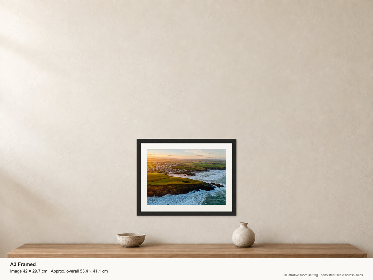 Round Hole at Sunrise — Trevone Bay — A3 framed, 22mm black stained frame and 35mm mount. Illustrative room view and dimensions.