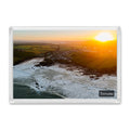 Trevone fridge magnet showing a golden sunrise spreading across Trevone Bay, its water and shoreline, seen head-on from over the sea