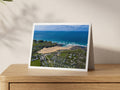 Premium A5 greeting card showing Treyarnon Bay beach beneath a deep blue spring sea
