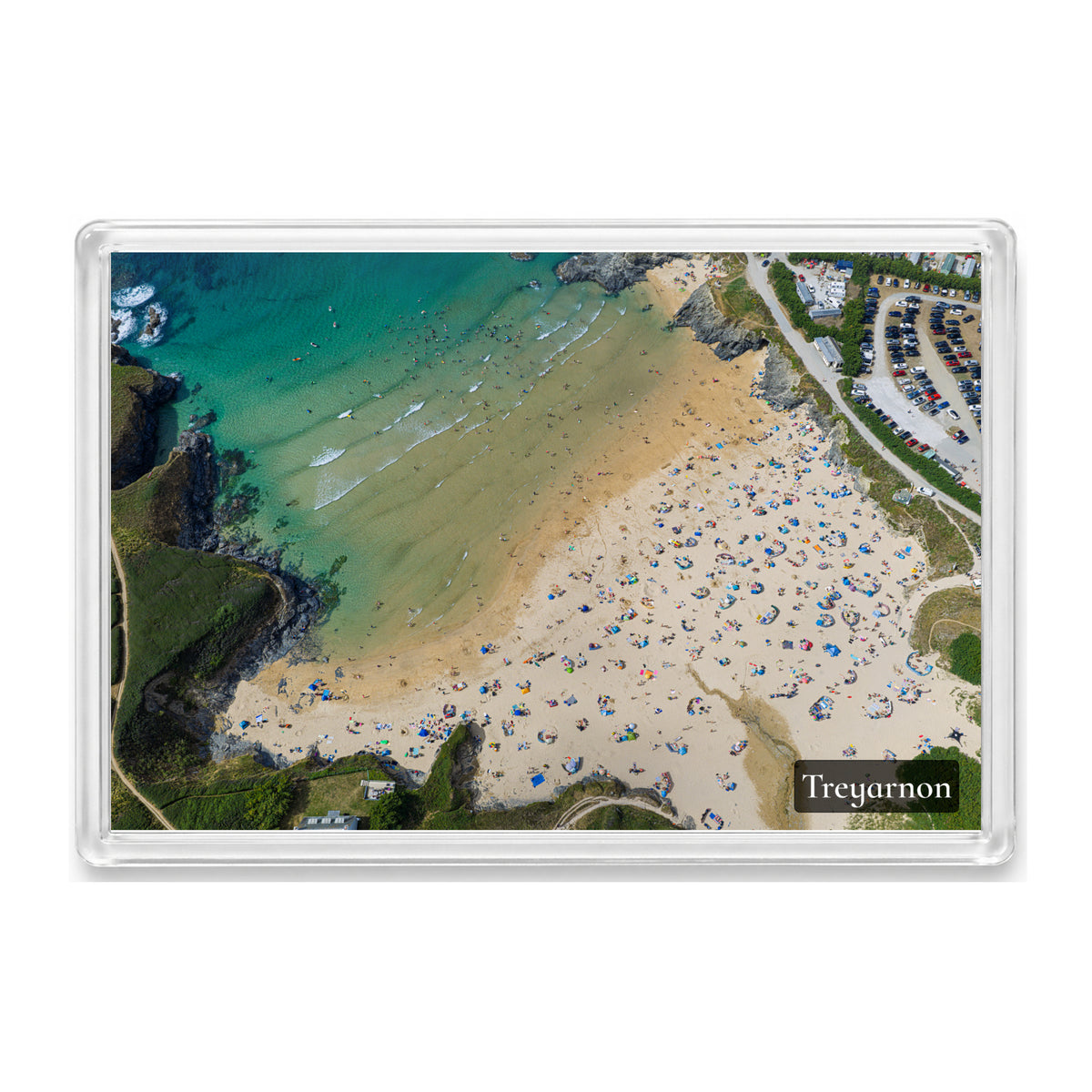 Treyarnon Bay fridge magnet showing hundreds of people on the sand beside clear blue water on a hot summer holiday day