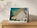 Premium A5 greeting card showing a crowded Treyarnon beach from above beside clear blue water