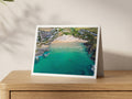 Premium A5 greeting card showing swimmers and paddleboarders in turquoise water at Treyarnon Bay