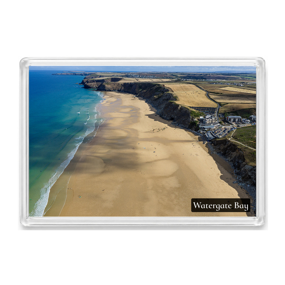 Watergate Bay fridge magnet showing the low-tide beach looking north with turquoise water, surf lines and cliffs