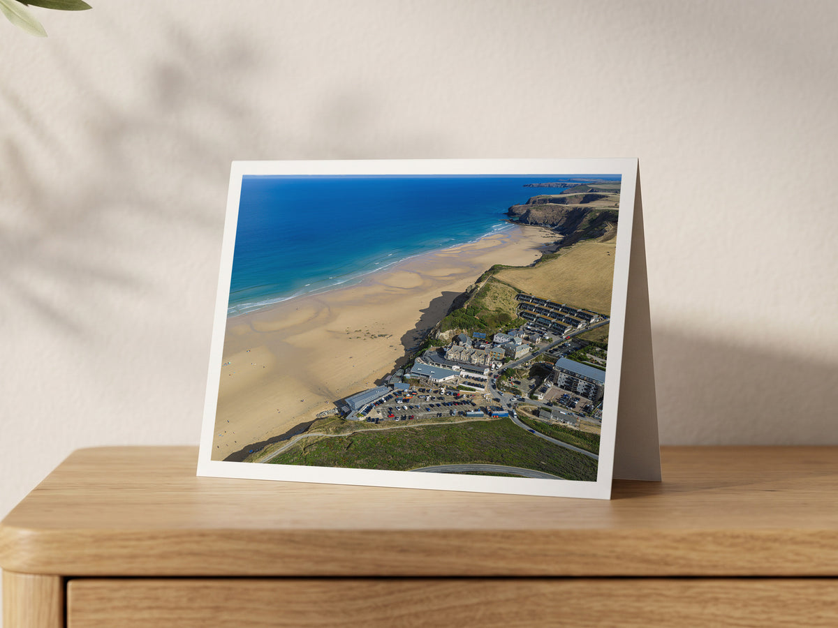 Premium A5 greeting card showing Watergate Bay beachfront buildings beside the low-tide beach