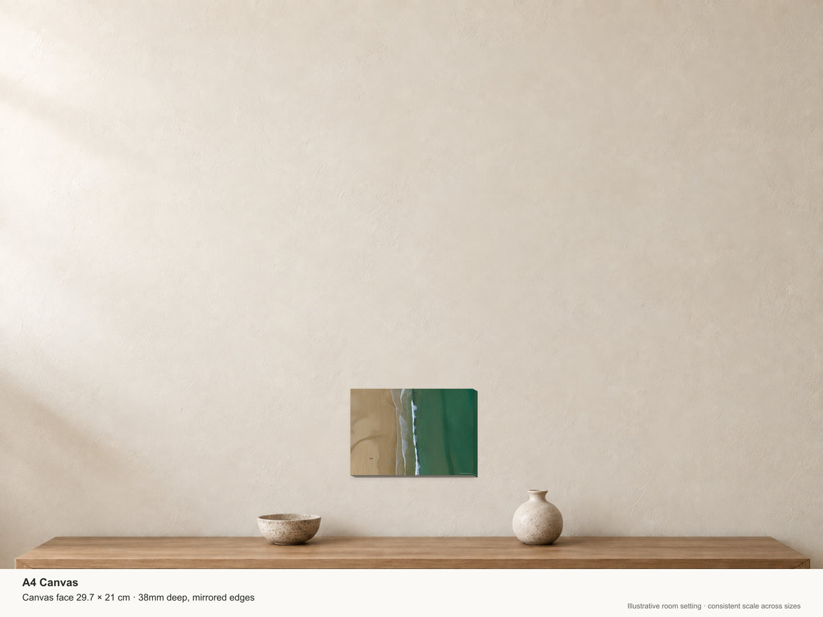Watergate Bay — Sand and Sea from Above — A4 canvas, 38mm-deep canvas with mirrored edges. Illustrative room scale and dimensions.