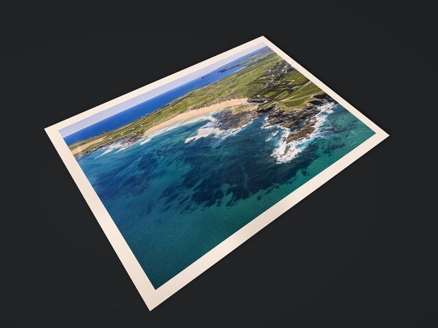 The Constantine Bay print at an angle, with light across the glossy paper
